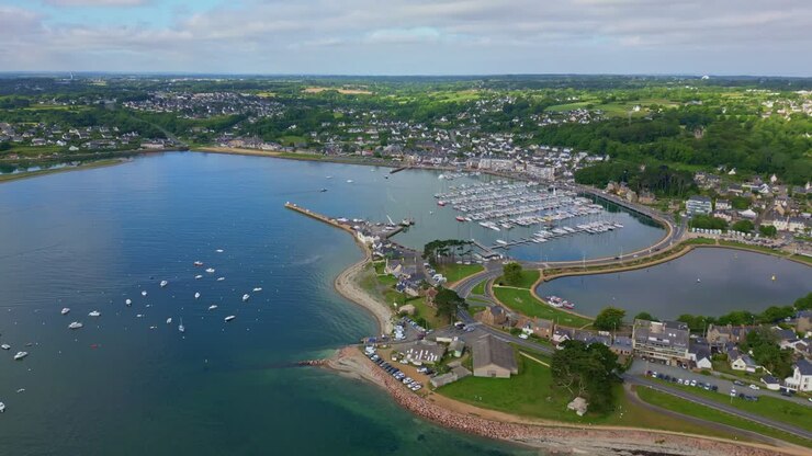 High altitude backward drone movement near the harbor of the Perros-Guirec, Brittany, France.