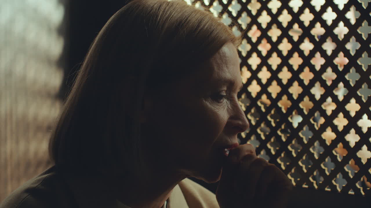 Female Parishioner Having Private Talk with Priest during Confession