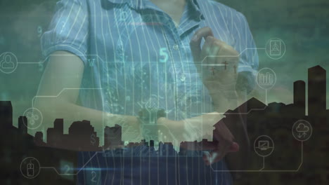 interacting with digital cityscape and data overlay, person wearing striped shirt