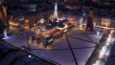 Winter-in-Krakow,-Poland---Aerial-view-of-Main-Market-Square,-Sukiennice,-St