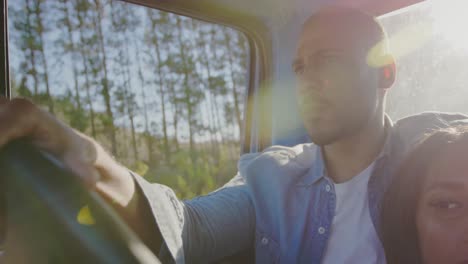 young couple on a road trip in their pick-up truck