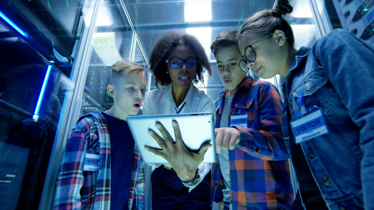Children learning about technology in a server room