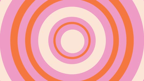 fondo animado abstracto con círculos concéntricos pulsantes de color rosa y naranja y centro tembloroso
