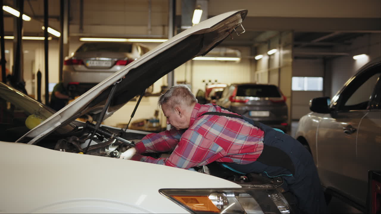 Mechanic repairing a car in a garage