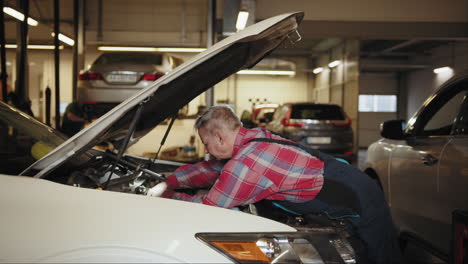 mechanic repairing a car in a garage