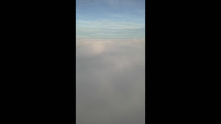 Amazing view over clouds at sunset