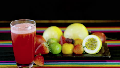 fresh fruits and a glass of strawberry juice