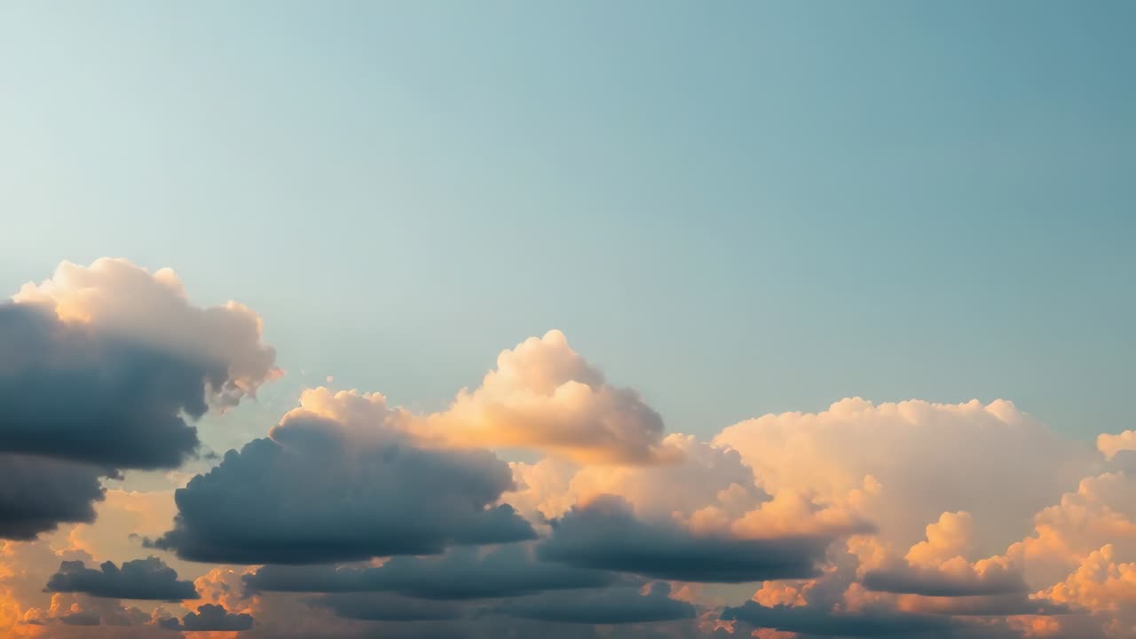 Drifting cumulus clouds shifting across sky as sun descends, showing golden to purple hues