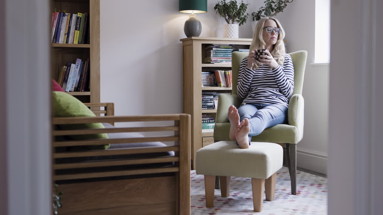 Woman Relaxing in Chair at Home