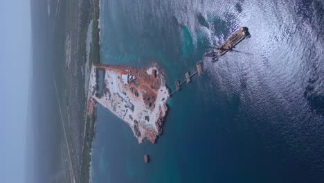 vertical drone shot of large construction site during building phase of new port harbor in pedernales