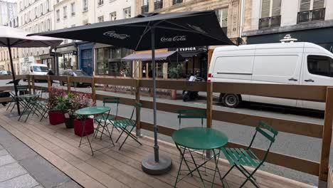 empty cafe seating area on paris street