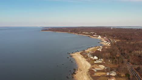 a high angle aerial shot, looking down along an empty beach while it was quiet and peaceful on a sunny afternoon