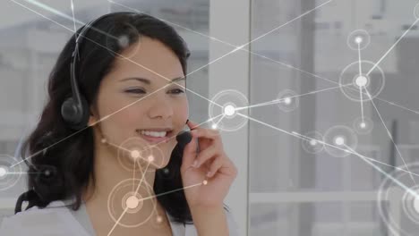 Animation-of-network-of-connections-with-globe-over-businesswoman-using-phone-headset