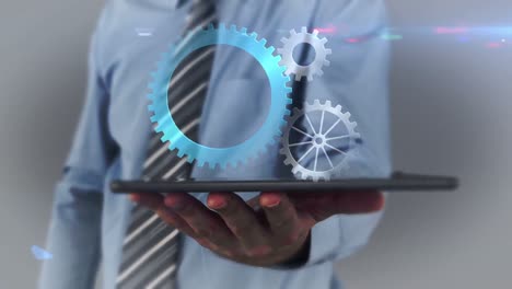 businessman using tablet to view hologram