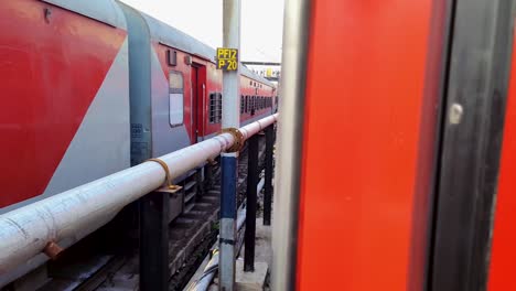 passenger-train-standing-on-track-crossing-each-other-from-opposite-direction-at-morning-video-is-taken-at-new-delhi-railway-station-on-Aug-04-2022