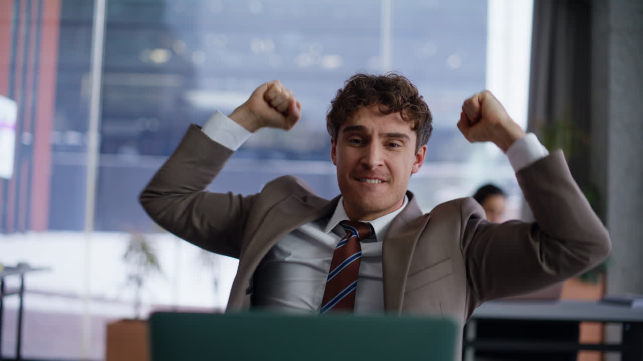 Surprised winner reading laptop in panoramic office closeup. Excited manager win