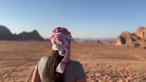 beautiful women with bedouin makeup in the red desert of wadi rum, jordan