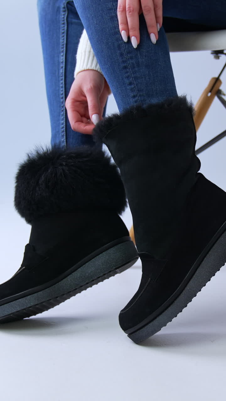Woman Wearing Black Fur Trimmed Boots