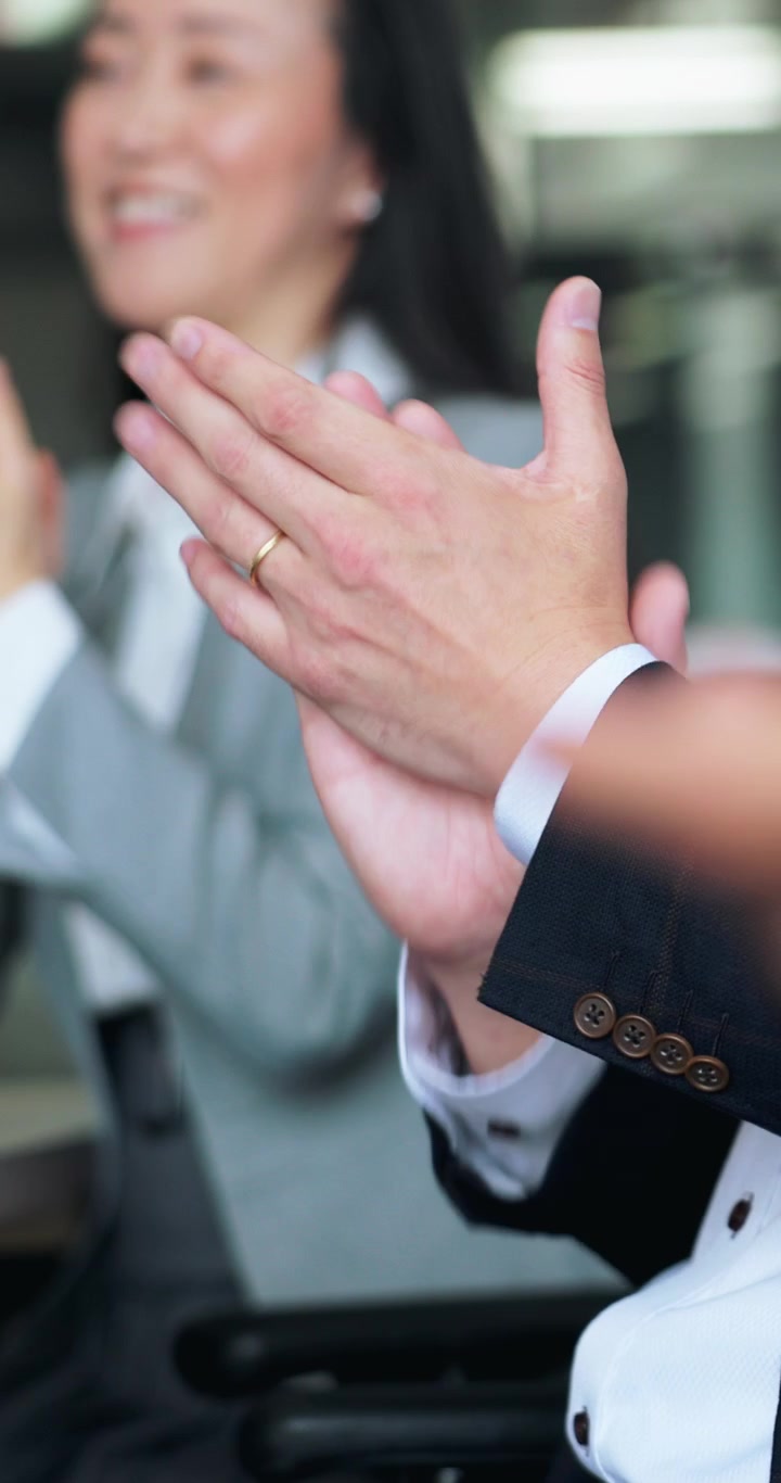 Business Professionals Applauding During a Corporate Meeting