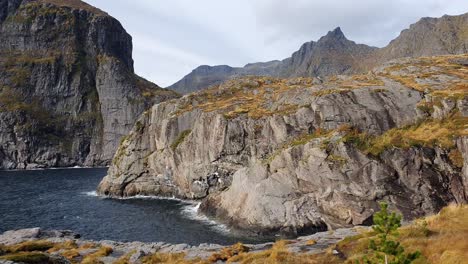 dramatic mountainous steep cliffs at the shore of lofoten