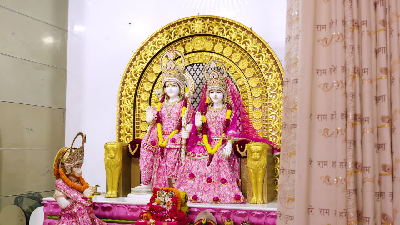 Cinematic view of the Hindu deity Lord Rama and Sita with Hanuman, Interior view of an Indian temple of Lord Rama.