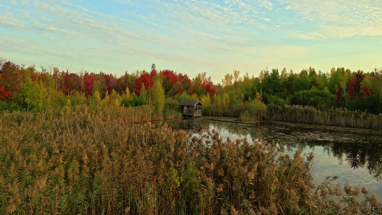 Amazing drone movement towards a wooden observation hut on autumn landscape, North America, Quebec, Montreal, Canada.