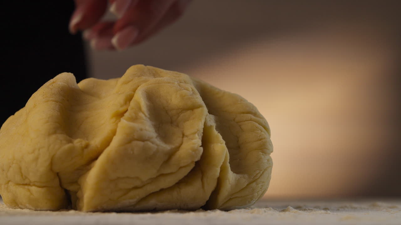 Dough For Cinnamon Roll Sprinkled With Flour. closeup, slow motion