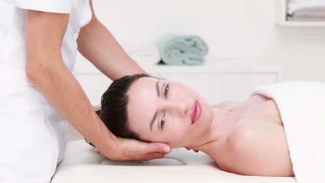 physiotherapist doing neck massage to her patient