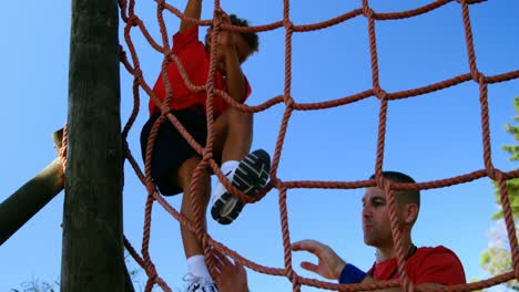 trainer training kids in the boot camp