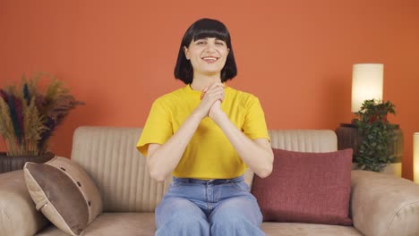 Woman-looking-at-camera-making-confidence-sign.