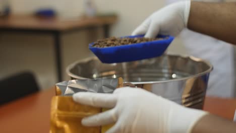 roasted coffee beans filled inside package.