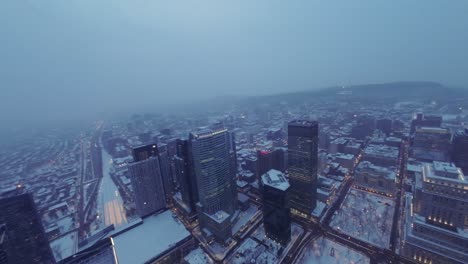 beautiful aerial view of montreal downtown during winter morning, fog covered cityscape at square dorchester with snow and serene atmosphere, drone view.