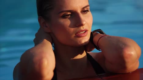 woman relaxing by pool
