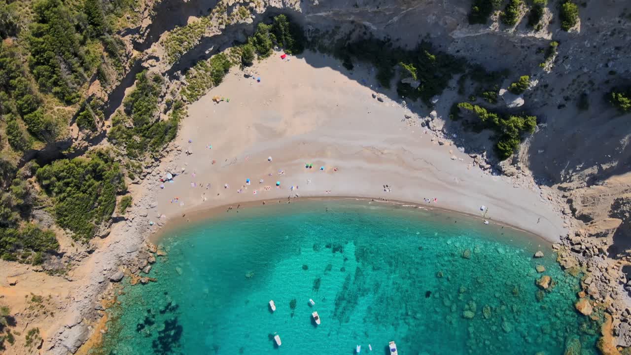 Enjoy the stunning views of Coll Baix beach at Puerto de Alcudia in Majorca. Experience the crystal clear waters and serene surroundings perfect for relaxation and beach activities.