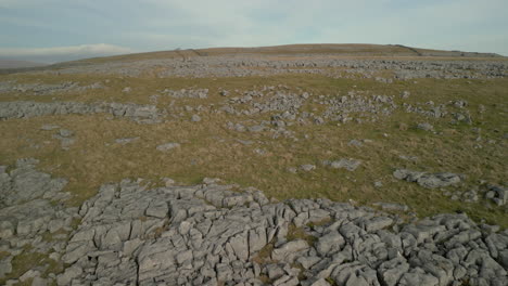 flying over rocky hillside in english countryside at ingleton yorkshire uk