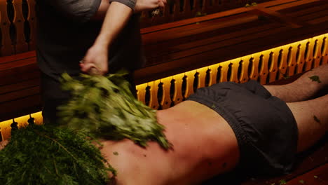 man getting a traditional sauna treatment
