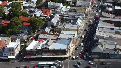 aerial shot of australian busy suburb with heavy traffic on roads with cars and businesses