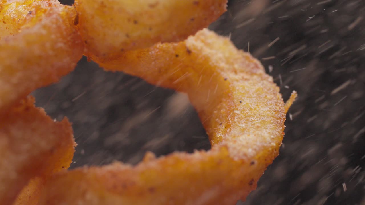 Seasoning condiments, tasty fries, delicious food, slow motion, close-up
