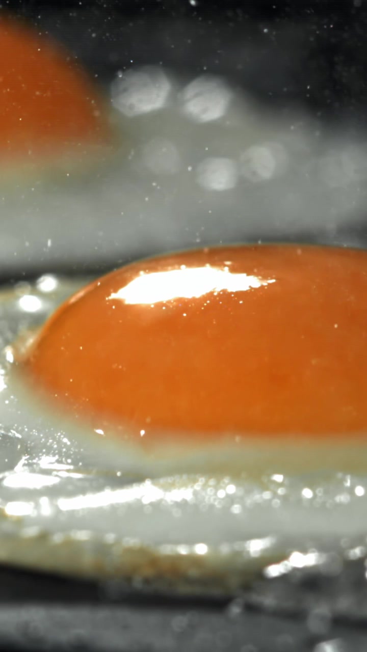 Close-up of a Fresh Egg Frying in a Hot Pan