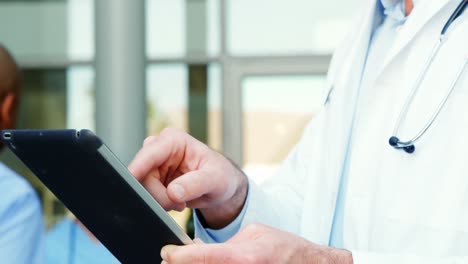 doctor using a digital tablet in hospital