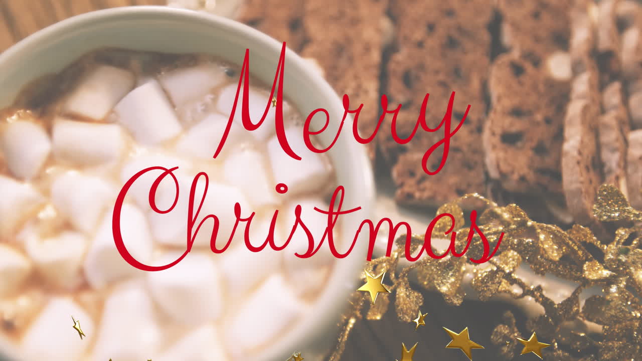 뜨거운 초콜릿의 클로즈업에 대한 황금색 별과 메리 크리스마스 텍스트 배너의 애니메이션