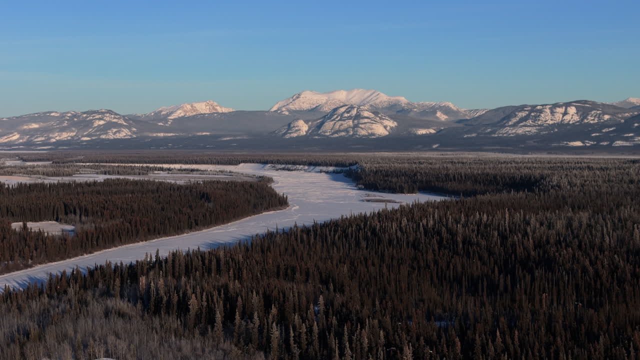 Frozen Yukon River During Winter In Canada - Aerial Shot