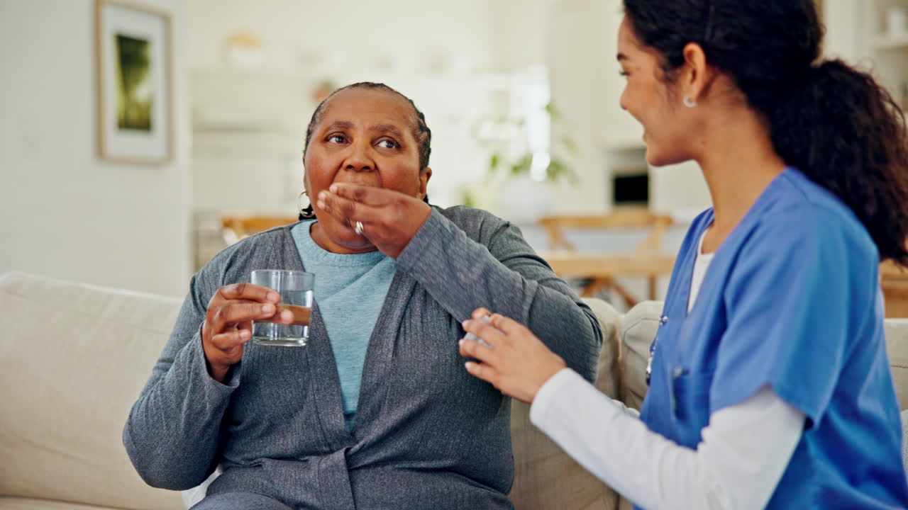 Medicine, old woman and caregiver on sofa