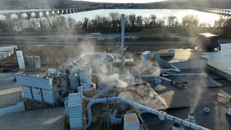 panoramic drone view of the roof of a metal processing plant with industrial cooling and ventilation infrastructure