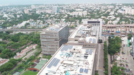 aerial shot of corporate buildings filled with solar panels to self-sustain electricity