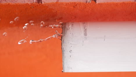 leaking water from damaged gutter