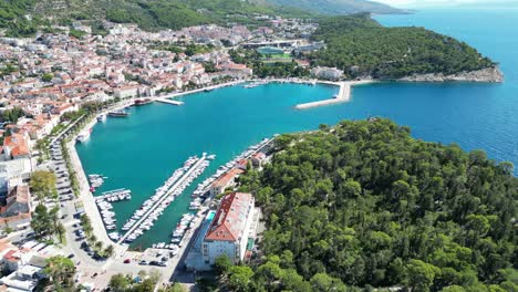 establishing shot makarska port town croatia’s dalmatian coast drone aerial view