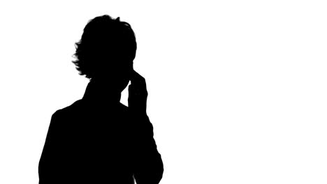 silhouette happy businesswoman speaking at the phone track matte