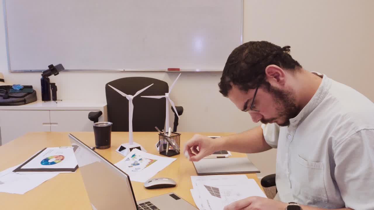 Male Engineer Adjusting Stylus Before Using a Graphics Tablet
