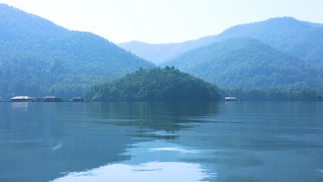 calm water reflecting a tranquil mountainous scene